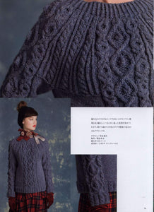 Round knit sweater with cables