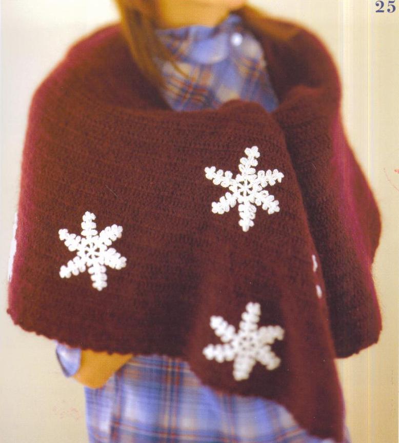 Crochet cape with white snowflakes pattern