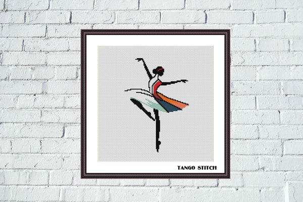Framed artwork of a dancer with a colorful skirt on a white brick wall. Beautiful ballerina minimalistic cross stitch pattern - Tango Stitch