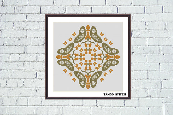Framed artwork with butterfly pattern on a white brick wall, Dancing butterflies cross stitch pattern - Tango Stitch