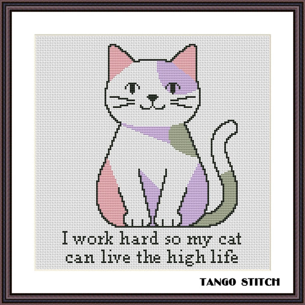 A framed cross-stitch style design featuring a white cat with pastel pink, purple, and olive green sections, with the text 'I work hard so my cat can live the high life' below. The brand name 'TANGO STITCH' appears in the bottom right corner. Humorous Pet Quote Embroidery cross stitch pattern - Tango Stitch