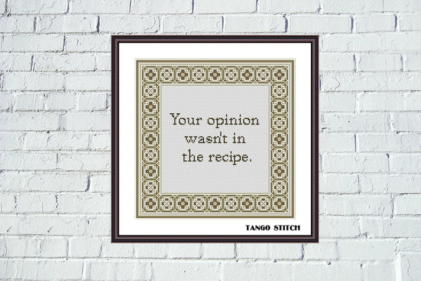 Framed print with text 'Your opinion wasn't in the recipe.' by Tango Stitch on a white brick wall.