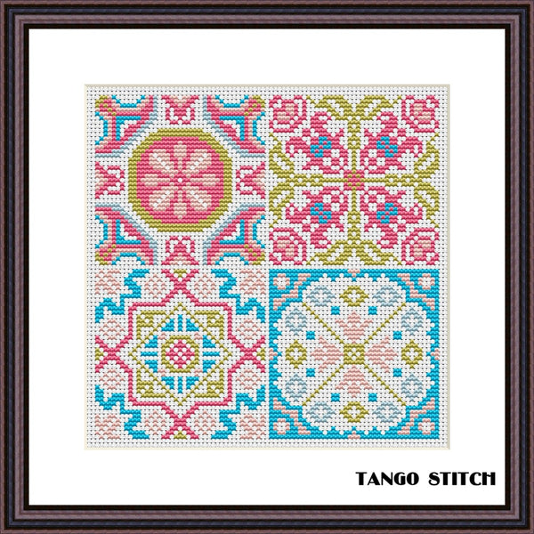 Colorful geometric pattern with floral elements on a white background, framed by a black border with 'Tango Stitch' branding. Vintage blue pink sampler cross stitch pattern - Tango Stitch